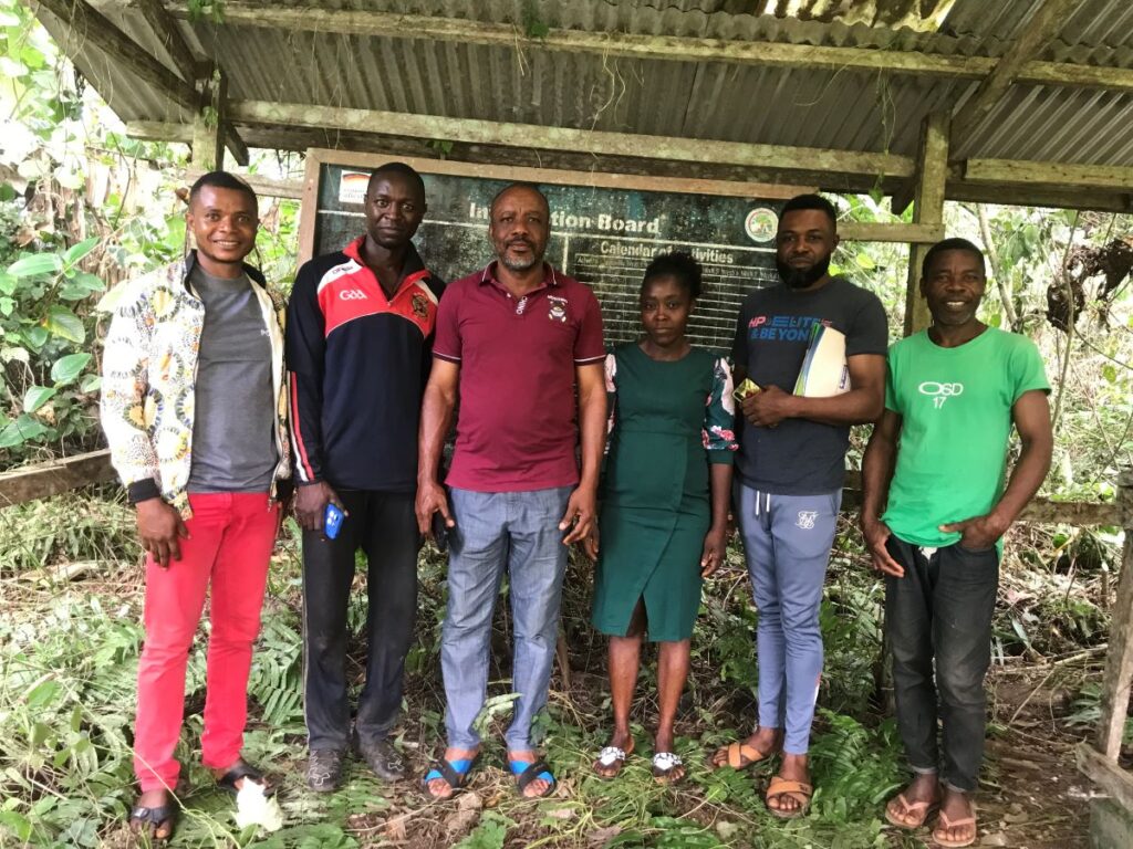 Mr. Evambe Thompson with community members