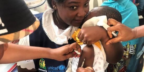 Child receiving polio vaccination